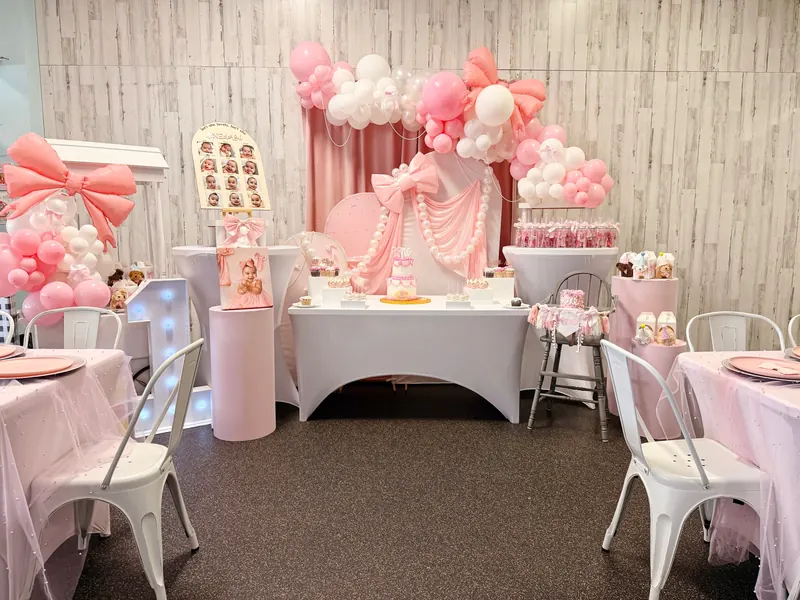 A decorated party room at Millie Moo's with pastel styling and table settings